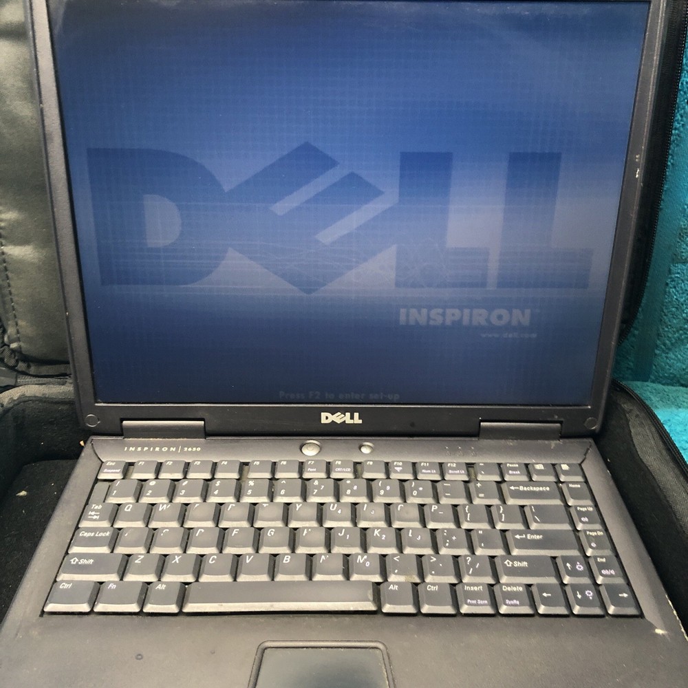 Dell inspirion 2650 laptop with bag and charger Pentium FOR parts