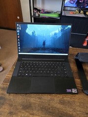black Razer 14″ Gaming Laptop with razer rgb laptop stand and power supply unit